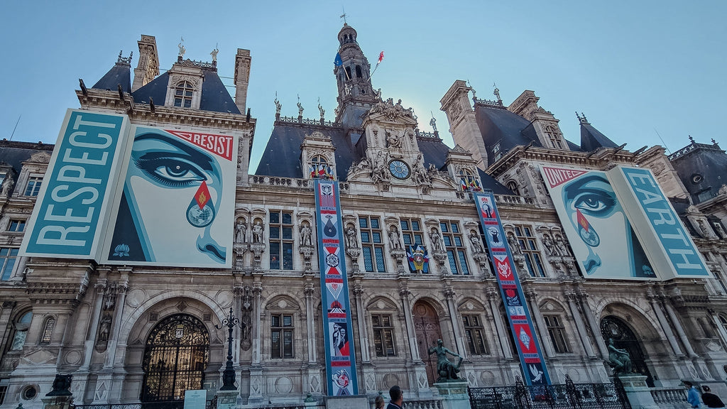 Posters reading “Respect” and “Earth” on the façade of Hôtel de Ville in Paris.