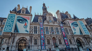 Posters reading “Respect” and “Earth” on the façade of Hôtel de Ville in Paris.